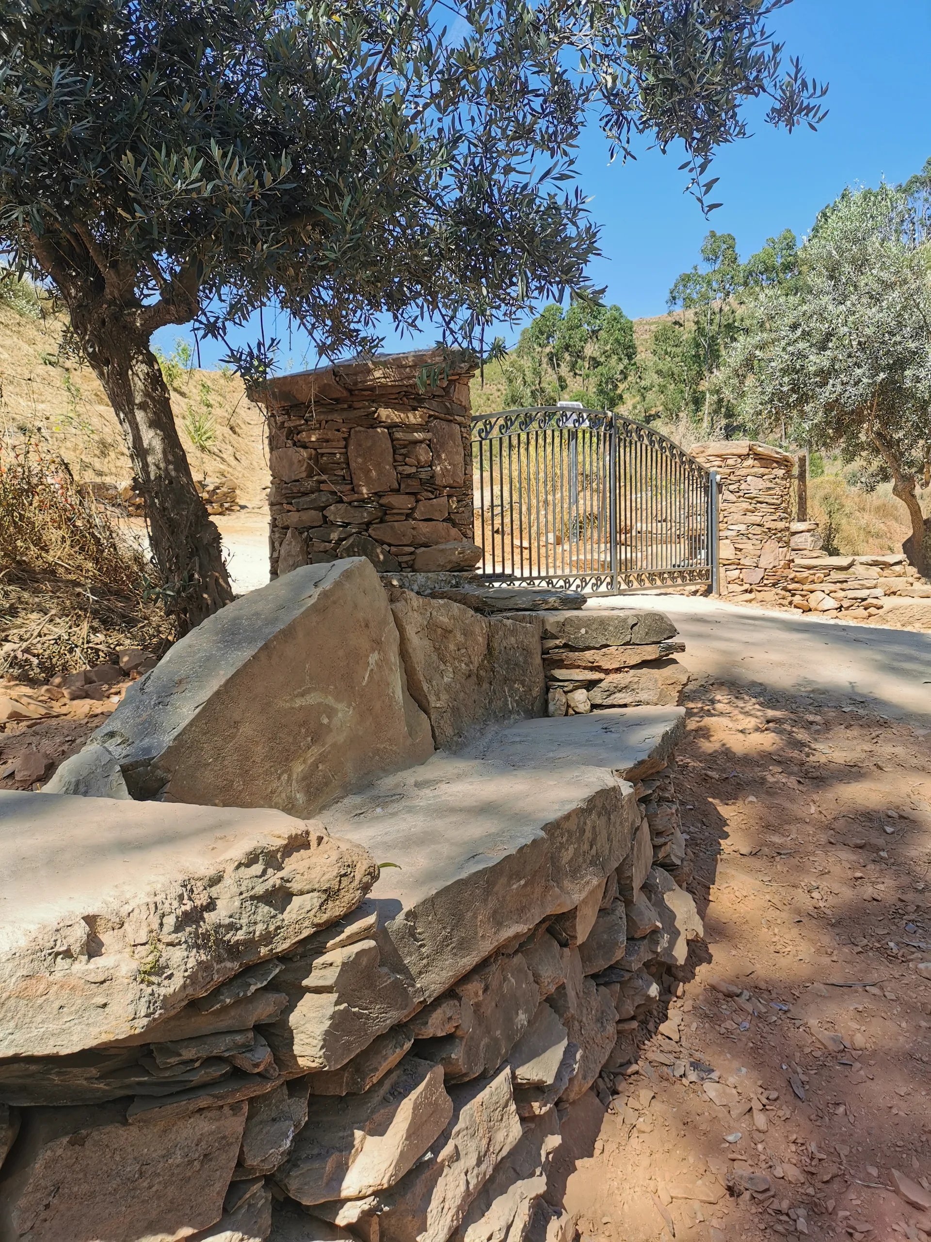Seat slabs and bench looking out to the gateway